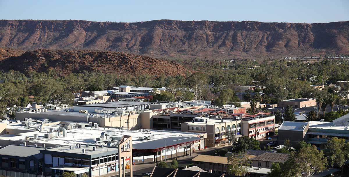 Aerial view of Alice Springs with the MacDonnell Ranges in background 